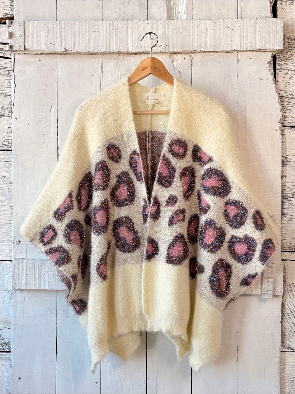 By Anthropologie Fuzzy Leopard Print Sparkle Poncho Sweater Cape
New w/o tags.